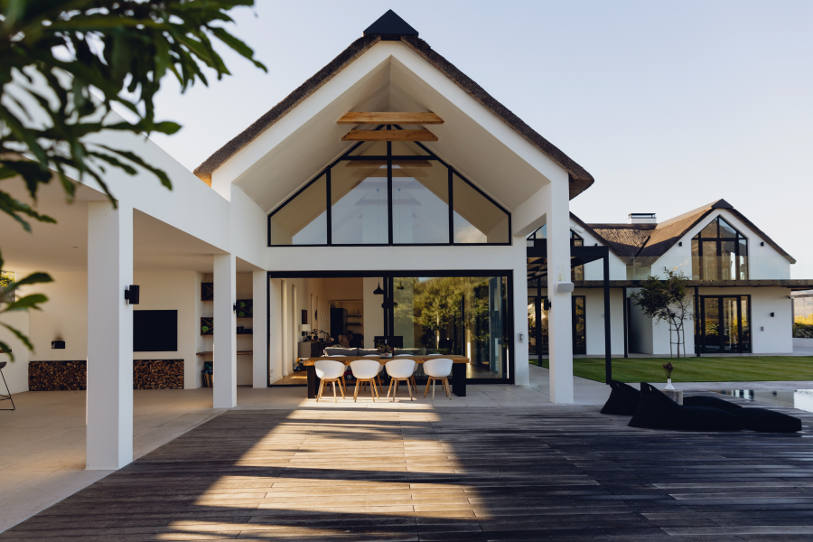 Exterior of a luxury modern house featuring large windows, clean lines, and a spacious design for a sophisticated look.